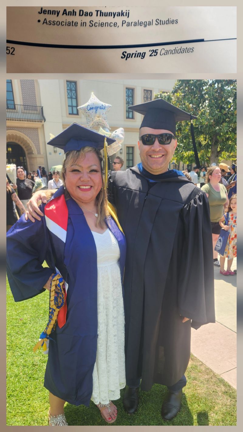 Two people in graduation garb
